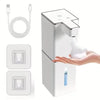 USB rechargeable automatic foam soap dispenser in white with USB charging cable and two adhesive wall mount brackets, dispensing foam soap into hand