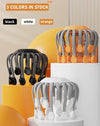 Octopus head massager available in 3 colors: black, white, and orange, displayed on pedestals