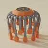 Orange octopus electric head massager with gray arms and orange massage tips, touch control panel on top, on beige background