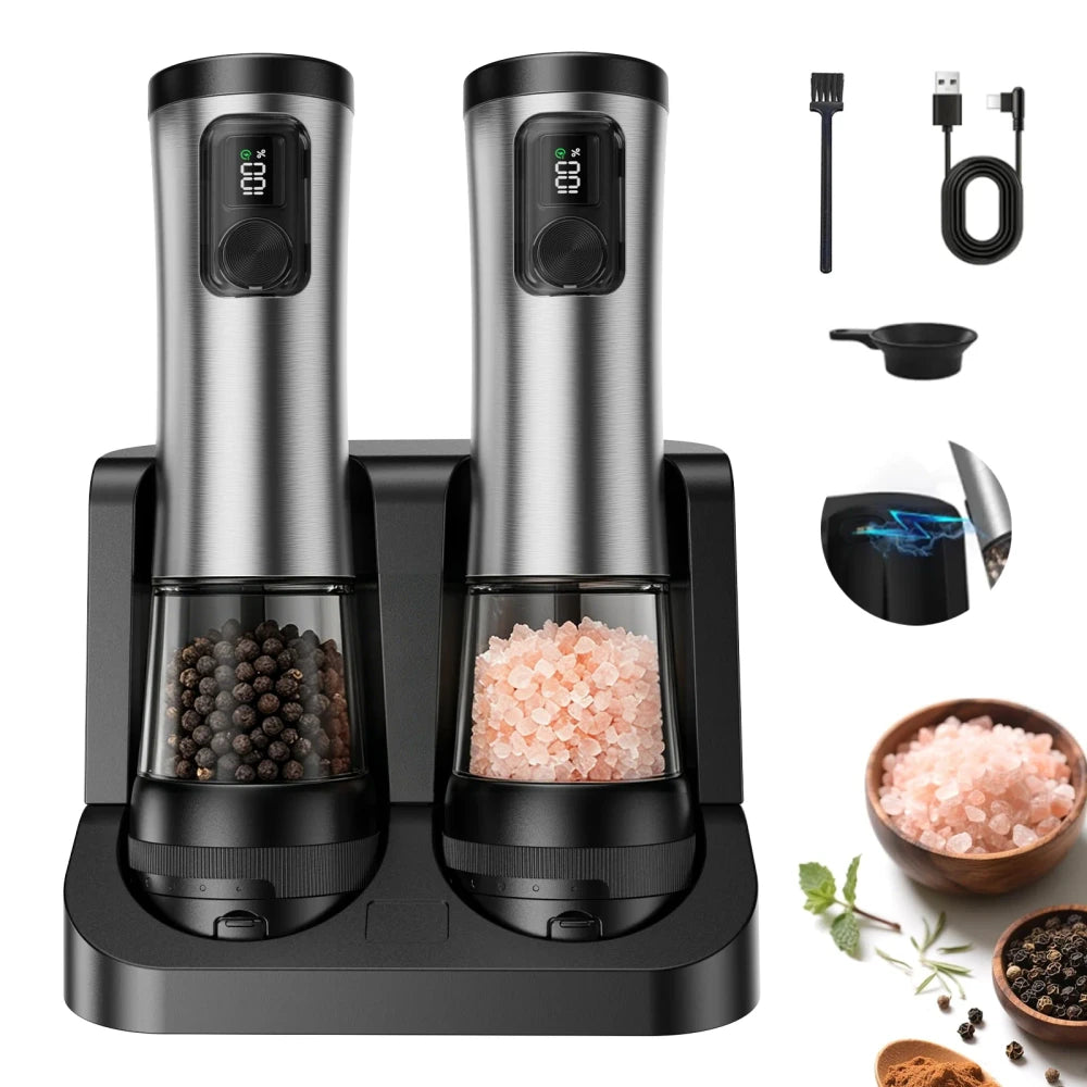 Stainless steel electric salt and pepper grinder set on charging base with peppercorns and himalayan salt in clear chambers; includes USB charging cable, filling funnel, magnetic charging connector, and himalayan salt and pepper bowls, on white background