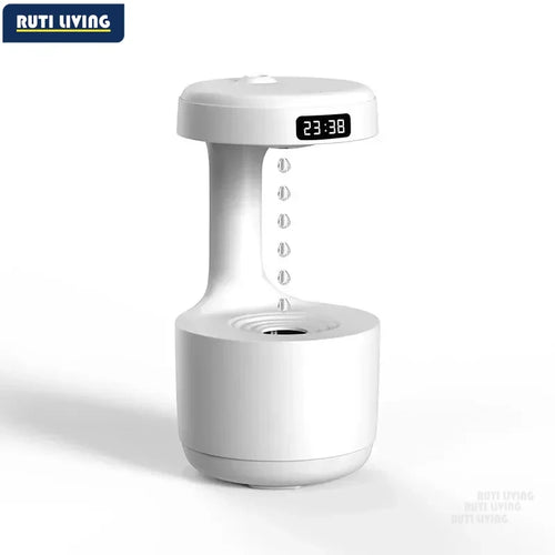 Anti-gravity ultrasonic air humidifier with floating water droplets and LED clock display on white background