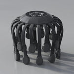 Black octopus electric head massager with dark gray arms and black massage tips, touch control panel on top, on gray background