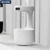 Anti-gravity humidifier with LED temperature and humidity display showing floating water drop effect on desk