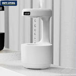 Anti-gravity humidifier with LED temperature and humidity display showing floating water drop effect on desk