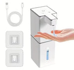 USB rechargeable automatic foam soap dispenser in white with USB charging cable and two adhesive wall mount brackets, dispensing liquid soap into hand