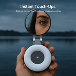 TELESIN magnetic selfie ring light held open in hand showing built-in mirror for instant makeup touch-ups, with close-up of woman's eye reflected