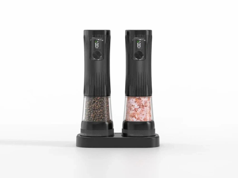 Black electric salt and pepper grinder set with dual charging base, LED displays and fingerprint sensor buttons, clear chambers showing peppercorns and pink himalayan salt, on white background
