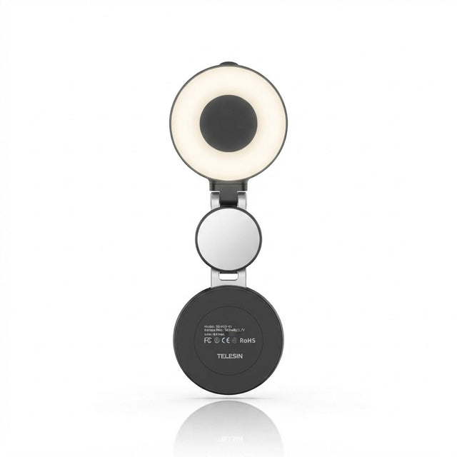 TELESIN magnetic selfie ring light in black with built-in mirror, folded open showing ring light on top and magnetic base on bottom, white background