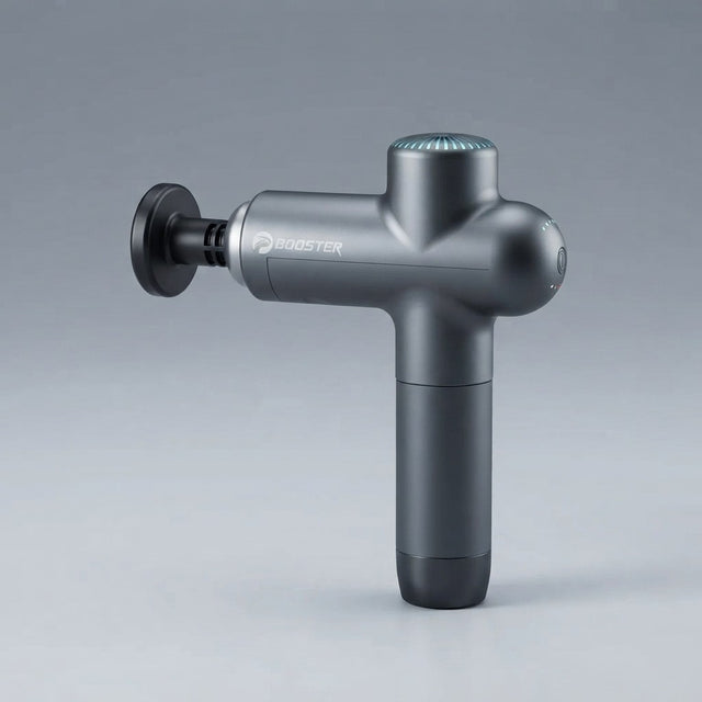Booster Lightsaber electric muscle massage gun in dark grey with teal LED top, flat disc attachment, and power button on grey background