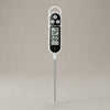 TP300 digital instant read meat thermometer in white with black display panel showing 33.4°F, Hold and C/F buttons, stainless steel probe, and hanging loop, on grey background